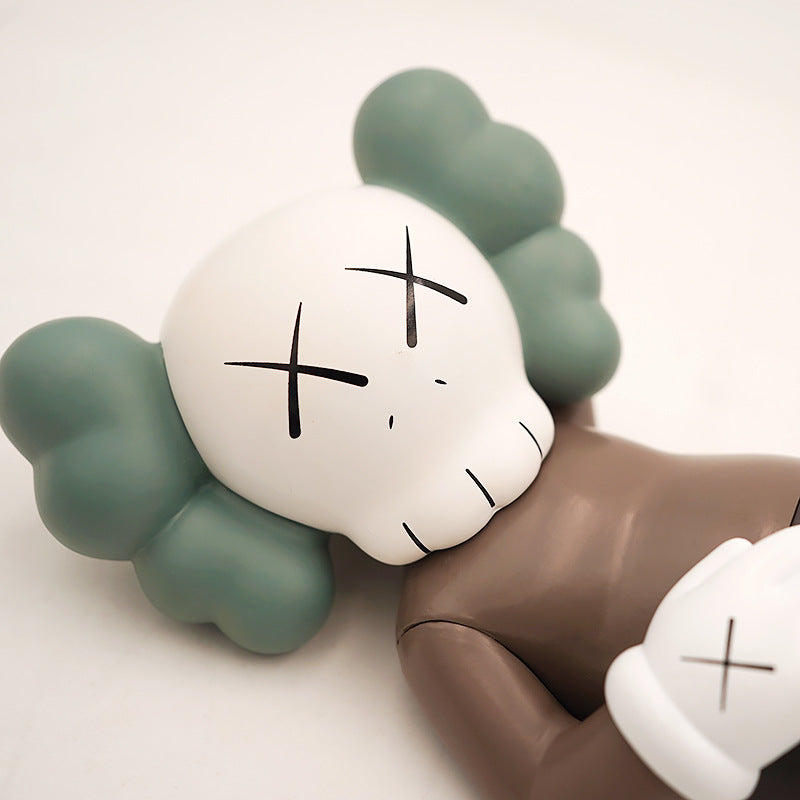 BRIAN LYING KAWS