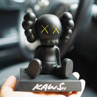 BRIAN SITTING KAWS