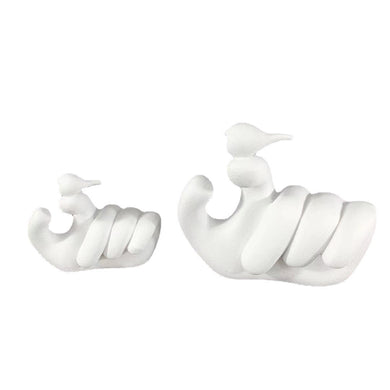 HUMAN HAND HOLDING A BIRD DECORATION